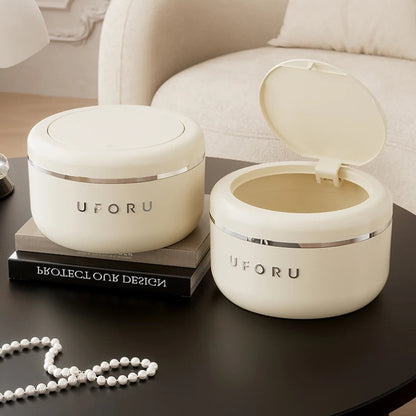 Le couvercle à pression ouvert de la Poubelle de chambre beige 2L