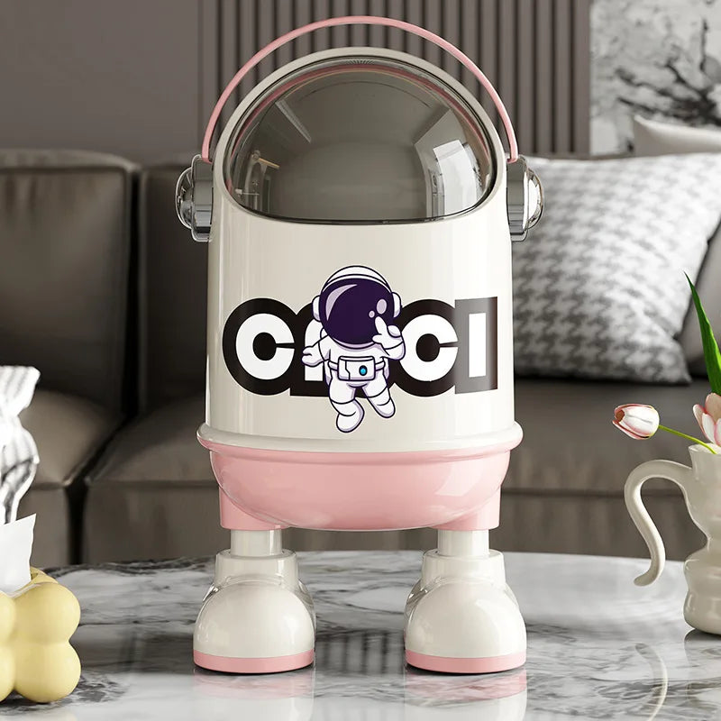 poubelle en plastique design astronaute rose dans le salon