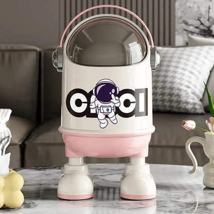 poubelle en plastique design astronaute rose dans le salon